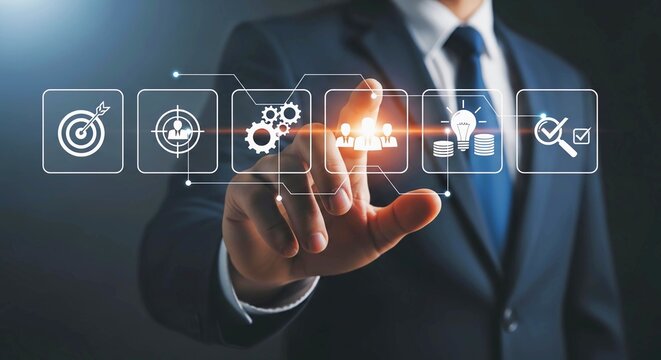 Businessman's hand touching a digital interface with icons representing business processes and goals.