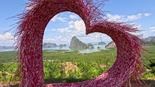 Woman Enjoys Scenic View Through Heart-Shaped Frame in Phuket