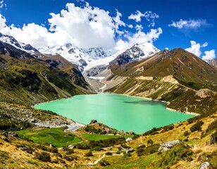 Serene mountain landscape with turquoise lake, snow-capped peaks