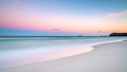 Serene Tropical Beach at Dusk with Gentle Waves and Soft Pastel Sky Overlooking the Ocean Horizon