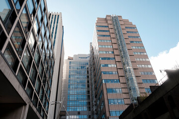 Modern business skyscrapers with glass facades reflecting city