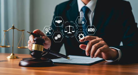 A legal professional in a formal suit uses a gavel, highlighting the core principles of law and justice with accompanying digital symbols.