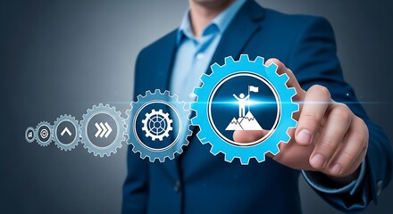Man in suit touching gear with flag on mountain, symbolizing achievement