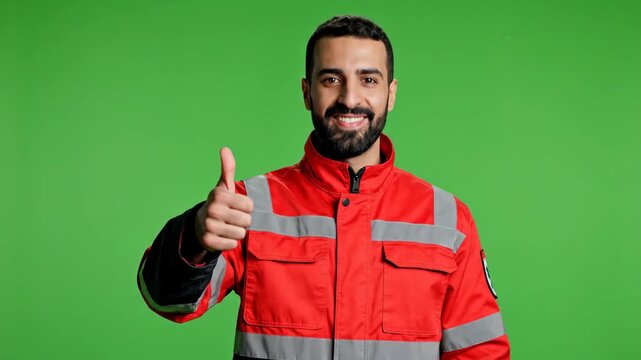 Positive Paramedic in Red Medical Uniform Gesturing Thumbs Up for Health and Success