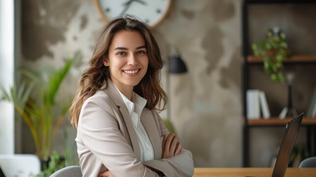 Smiling businesswoman in modern office ready for virtual meeting
