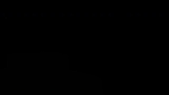 Closeup of burning hot bonfire fire sparks. Fire Particles over black background with smoke.