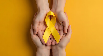 Two pairs of hands holding yellow awareness ribbon on yellow background, Symbolic support and solidarity with yellow ribbon, Studio shot emphasizing yellow ribbon for awareness cause, Hands offering a