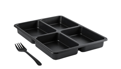 Black compartmentalized tray and utensil presented against a black backdrop in a studio-like setting