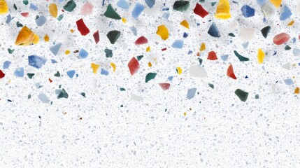 Fototapeta premium Vibrant colorful glass pieces scattered artistically on bright white background capturing beautiful light.