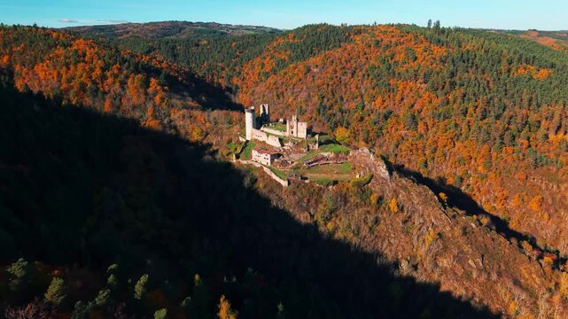 Aerial shot around the Rochebaron Castle near Bas en Basset in Haute Loire departement during fall season, Auvergne Rhone Alpes region, France