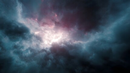 Obraz premium Dramatic clouds with vibrant pink and blue light breaking through a dark stormy sky creating an intense and ethereal atmosphere