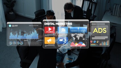 A diverse group of business professionals engages in collaborative digital marketing discussions with advanced technology and vibrant data visualizations in a modern office setting. Raster