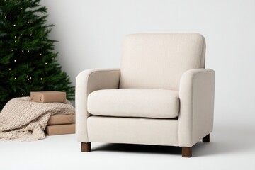 Fototapeta premium Cozy armchair beside festive tree and wrapped gifts, perfect for