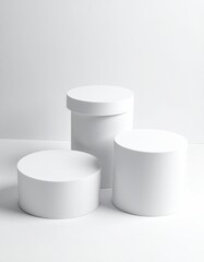 White cylinders, minimal composition, clean backdrop