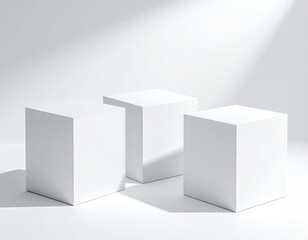 Fototapeta premium Three white cubes stand in sunlit, minimalist display