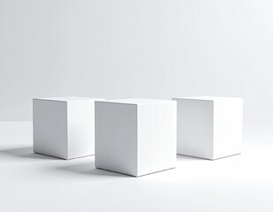 Three white cubes evenly spaced on a white surface