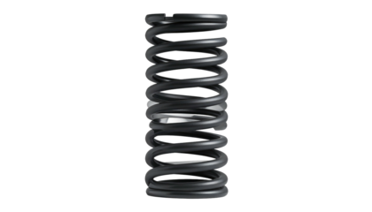 A cylindrical metal coil, dark gray in color, casts a soft shadow against a stark black backdrop