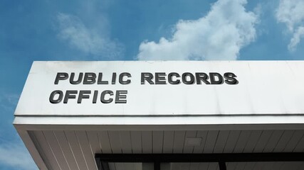 Public Records Office word sign displayed on a civic or government building under a clear blue sky, symbolizing official documentation, historical archives, institutional memory, and information
