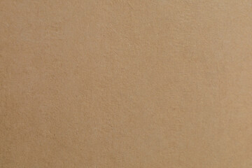 A detailed macro shot of a rich, brown textured surface, showcasing intricate patterns and subtle variations in tone, perfect as a warm, abstract background for design or product placement.