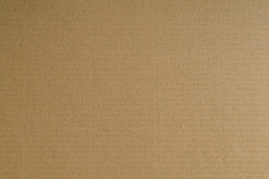 A detailed macro shot of a rich, brown textured surface, showcasing intricate patterns and subtle variations in tone, perfect as a warm, abstract background for design or product placement.