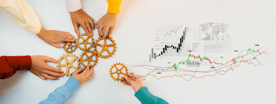 Diverse hands work together to operate gears, symbolizing teamwork and cooperation amid financial growth charts, showcasing data-driven business strategies. Scalp