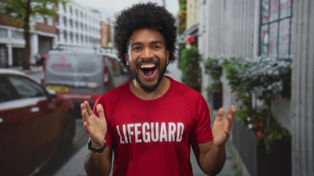 Man lifeguard standing on city street with big smile in urban setting outdoors captured in vibrant image showing excitement.