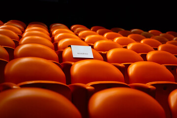 Fototapeta premium Reserved seating in an empty movie theater 