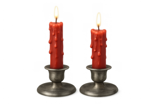 Pair of red dripping wax candles burning in vintage pewter candlesticks against a transparent background