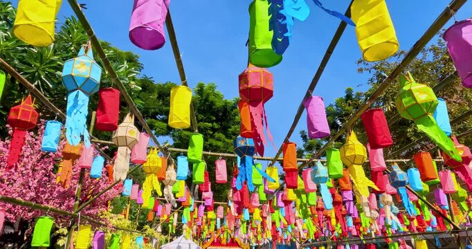 Colorful paper lanterns hanging on many strings against blue sky at Golden mount temple ,known as Wat Saket Ratcha Wora Maha Wihan