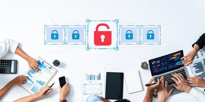 A diverse business team collaborates in a modern office, analyzing data and discussing strategies on security and privacy, represented by digital lock graphics. Trope