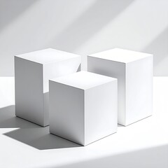 Three white cubes on white, light & shadow play