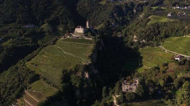 Tyrol castle, and Brunnenburg museum, Meran, Italy, Aerial drone video on summer day.