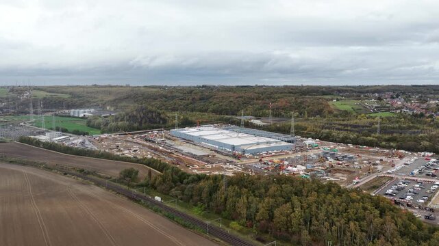 New constructed data center in Farciennes, investment of 1 billion euros, AI and artificial intelligience infrastructure. Aerial video.