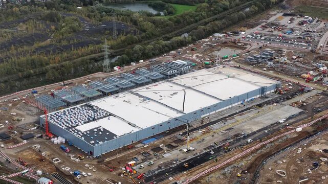 New constructed data center in Farciennes, investment of 1 billion euros, AI and artificial intelligience infrastructure. Aerial video.