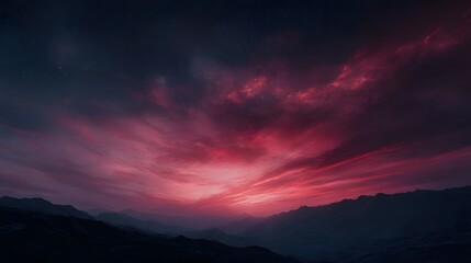 Dramatic crimson and pink sunset sky over dark rugged mountains under a starry twilight