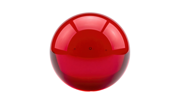 Glossy red sphere center frame against a stark black backdrop, displaying smooth, reflected light across its surface