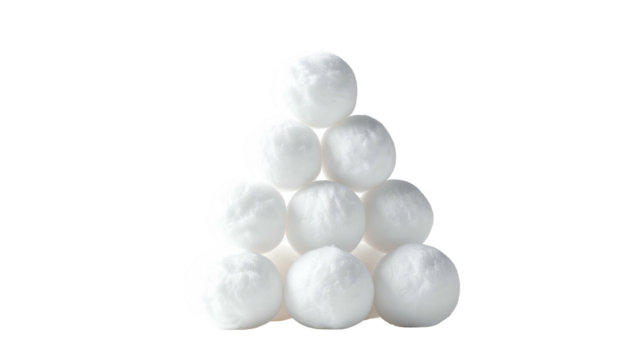 Ten white cotton balls, neatly stacked in a triangular pyramid against a black background. High key, product shot
