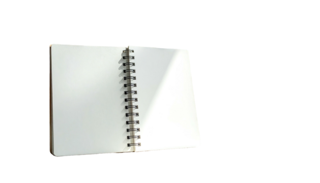 Open, blank spiral-bound notebook with white pages isolated against a stark black background; light on paper