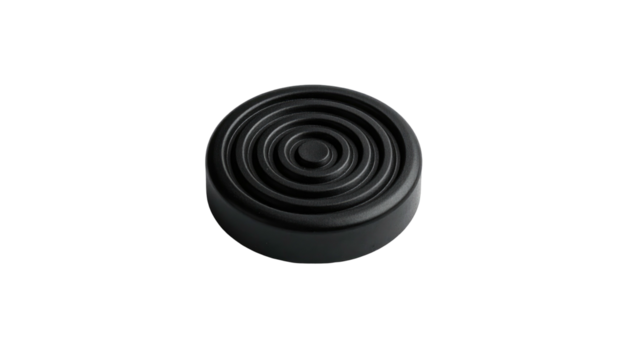 Isolated black disc with concentric ribbed circles emanating outwards from its center, against stark black backdrop