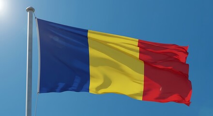 Romanian flag waving proudly against a clear blue sky on a bright sunny day, symbolizing national pride and unity in a patriotic display.