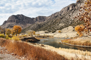 Fisherman in the Wind River Canyon Scenic Byway in Autumn in Central Wyoming.