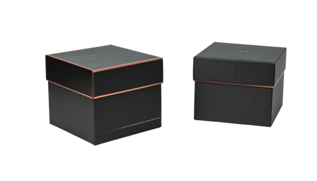 Two black square boxes with thin copper bands accenting edges, slightly offset, on black backdrop. Minimalist, elegant