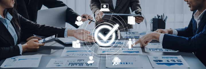 A dynamic business meeting showing a team collaborating on data analysis, engaging with reports and...