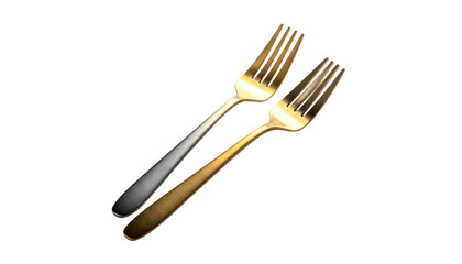 Two metallic forks, one gold and one silver, angled diagonally on a stark black background, highlighting their tines