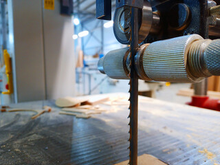 band saw in furniture production. close-up. curved  sawing
