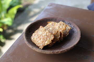Crispy Fried Tempeh on a Clay Plate