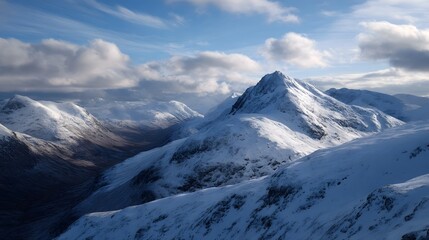 Snow dusted mountain summits rise majestically above shadowed valleys bathed in crisp winter sunlight under a cloudy blue sky