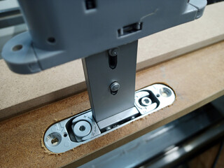 a milled hole for a door closer in a door frame. close-up of furniture production.