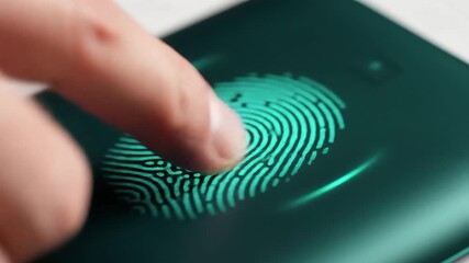 Closeup of a finger pressing on a glowing green fingerprint scanner on a dark surface symbolizing biometric security digital authentication and advanced technology for access control and data protect. - Powered by Adobe