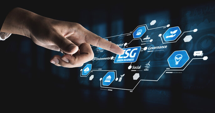 A hand interacts with a digital interface showcasing ESG elements, highlighting the importance of sustainable practices and corporate responsibility in today business landscape. Tessel - Powered by Adobe